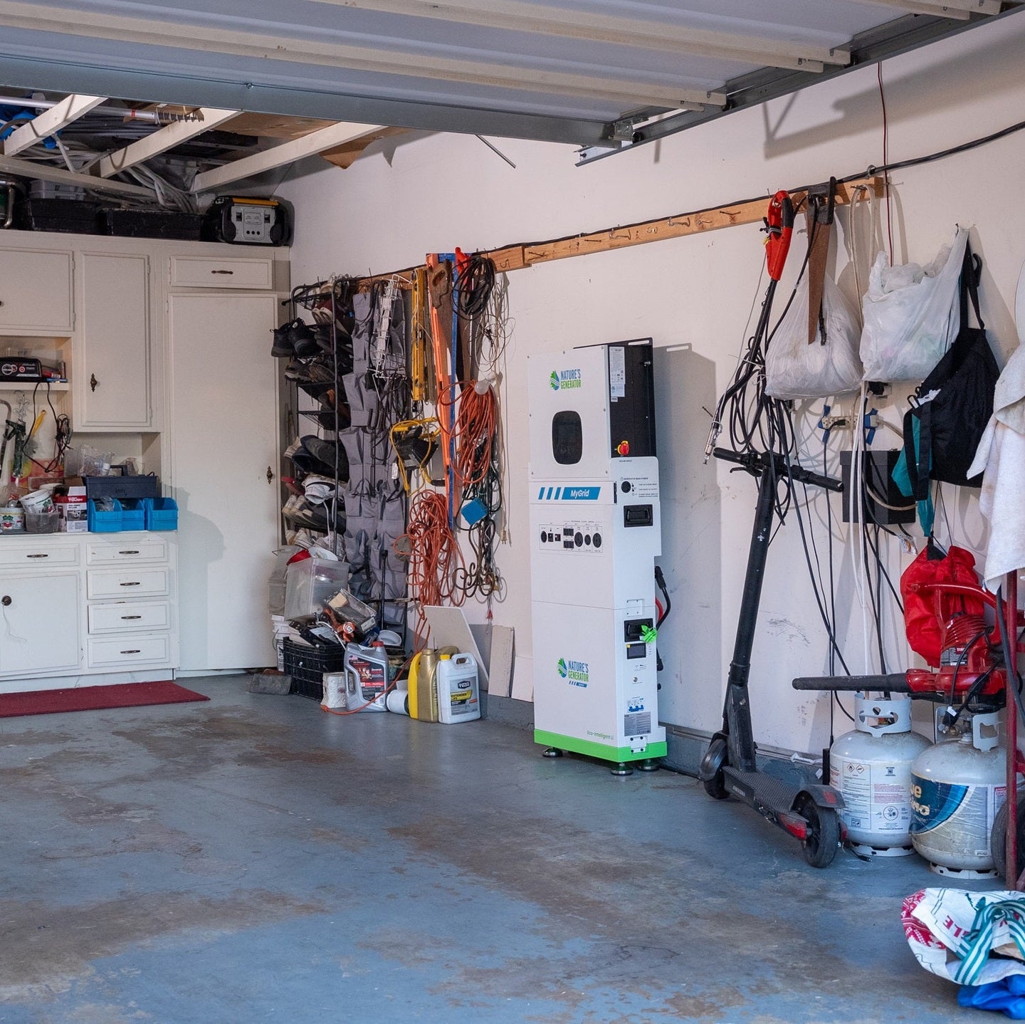 Scene 
Garage with tools, equipment, and a charging station.