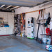Scene 
Garage with tools, equipment, and a charging station.